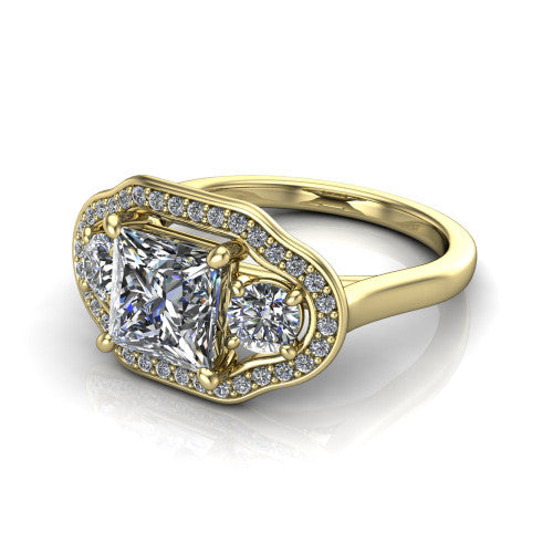 Makayla princess-cut three-stone halo engagement ring in 18K Yellow Gold, three-quarter perspective showing the princess-cut center diamond, two side stones, and individual pave halos on the east-west gallery