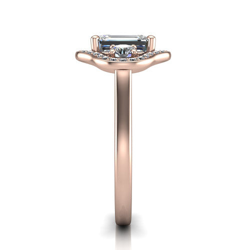Makayla emerald-cut three-stone halo engagement ring in 18K Rose Gold, side profile showing the cathedral rise, pave halos, and high-polish band