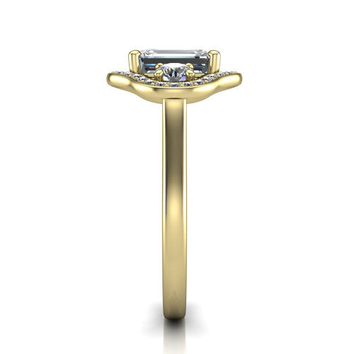 Makayla emerald-cut three-stone halo engagement ring in 14K Yellow Gold, side profile showing the cathedral rise, pave halos, and high-polish band