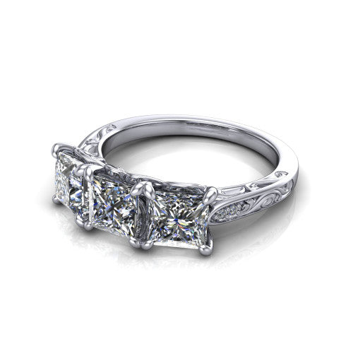 Navy princess three stone engagement ring in 18K White Gold, three-quarter perspective showing three princess diamonds above an engraved filigree band