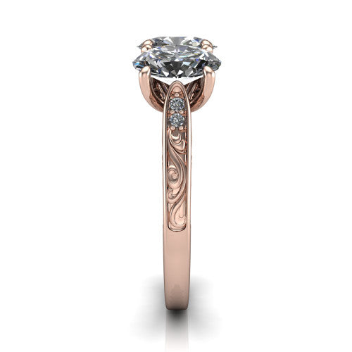 Navy oval three stone engagement ring in 18K Rose Gold, side profile showing the vintage engraved filigree band and the raised three-stone setting