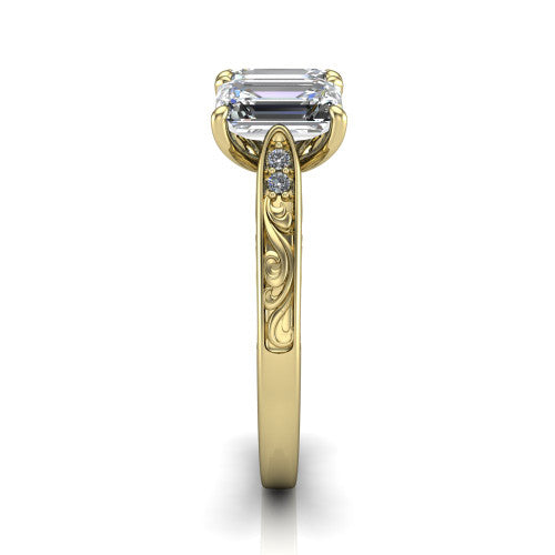 Navy emerald three stone engagement ring in 14K Yellow Gold, side profile showing the vintage engraved filigree band and the raised three-stone setting