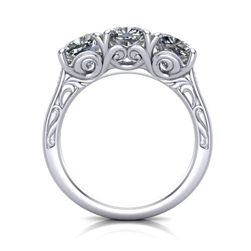 Navy cushion three stone engagement ring in 14K White Gold, through-finger front profile showing the filigree scroll gallery beneath the three stones