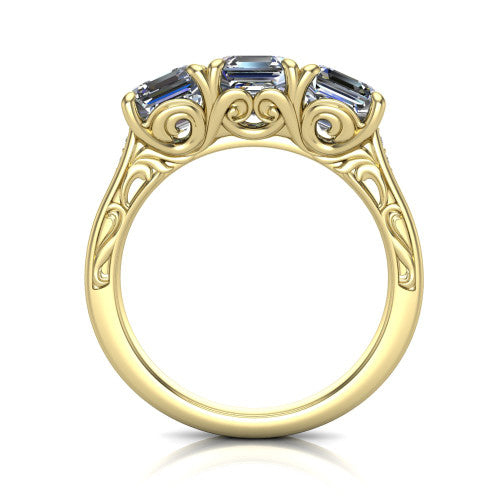 Navy square emerald three stone engagement ring in 14K Yellow Gold, through-finger front profile showing the filigree scroll gallery beneath the three stones