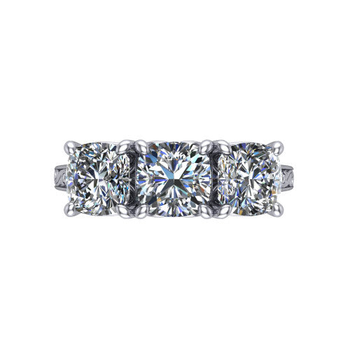 Navy cushion three stone engagement ring in 18K White Gold, top-down view showing the trio of cushion stones set in a row