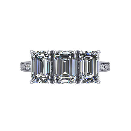 Navy emerald three stone engagement ring in Platinum, top-down view showing the trio of emerald stones set in a row