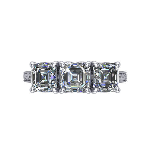 Navy square emerald three stone engagement ring in Platinum, top-down view showing the trio of square emerald stones set in a row