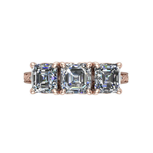 Navy square emerald three stone engagement ring in 18K Rose Gold, top-down view showing the trio of square emerald stones set in a row