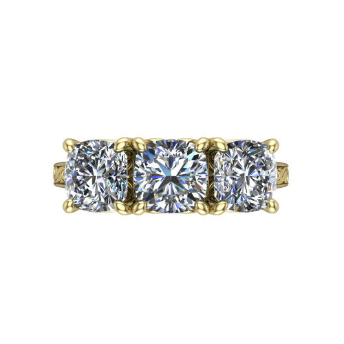 Navy cushion three stone engagement ring in 18K Yellow Gold, top-down view showing the trio of cushion stones set in a row