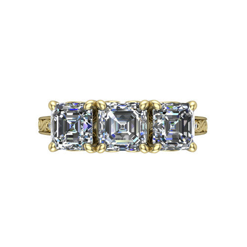 Navy square emerald three stone engagement ring in 18K Yellow Gold, top-down view showing the trio of square emerald stones set in a row