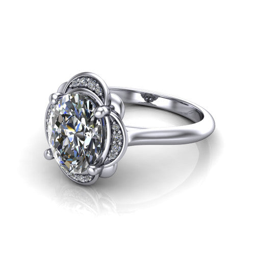 Anaya oval hidden halo engagement ring in Platinum, three-quarter perspective showing the oval center above a round pav&eacute; under-halo on a plain band