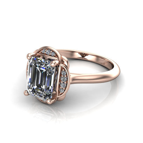 Anaya emerald hidden halo engagement ring in 18K Rose Gold, three-quarter perspective showing the emerald center above a round pav&eacute; under-halo on a plain band