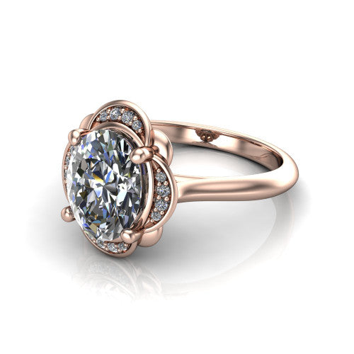Anaya oval hidden halo engagement ring in 14K Rose Gold, three-quarter perspective showing the oval center above a round pav&eacute; under-halo on a plain band