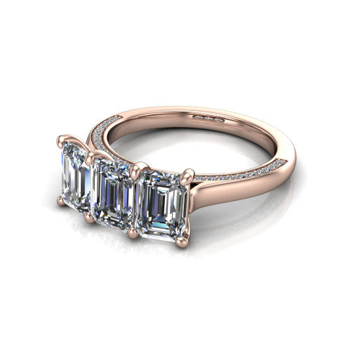 Maryam emerald three stone engagement ring in 18K Rose Gold, three-quarter perspective showing three emerald diamonds set side by side above a pav&eacute; band