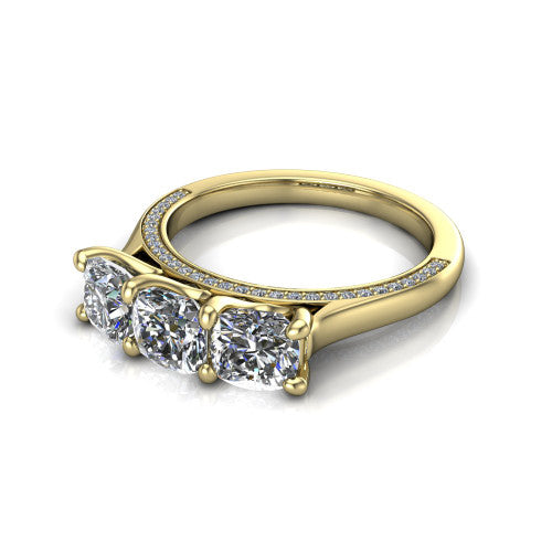 Maryam cushion three stone engagement ring in 14K Yellow Gold, three-quarter perspective showing three cushion diamonds set side by side above a pav&eacute; band