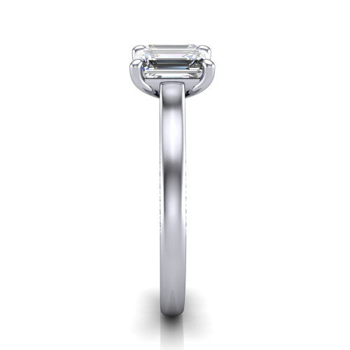 Maryam emerald three stone engagement ring in 18K White Gold, side profile showing the pav&eacute; band with milgrain edges and the raised three-stone setting