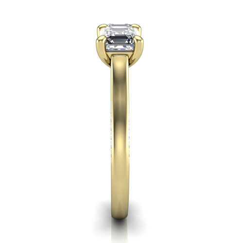 Maryam square emerald three stone engagement ring in 18K Yellow Gold, side profile showing the pav&eacute; band with milgrain edges and the raised three-stone setting