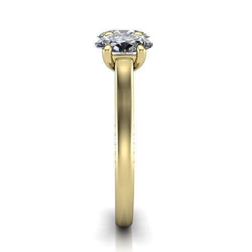 Maryam oval three stone engagement ring in 18K Yellow Gold, side profile showing the pav&eacute; band with milgrain edges and the raised three-stone setting