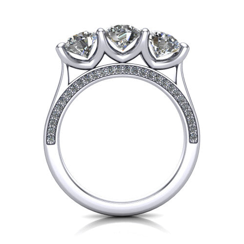 Maryam round three stone engagement ring in Platinum, through-finger front profile showing the three-stone head and diamond-accented gallery above the pav&eacute; band