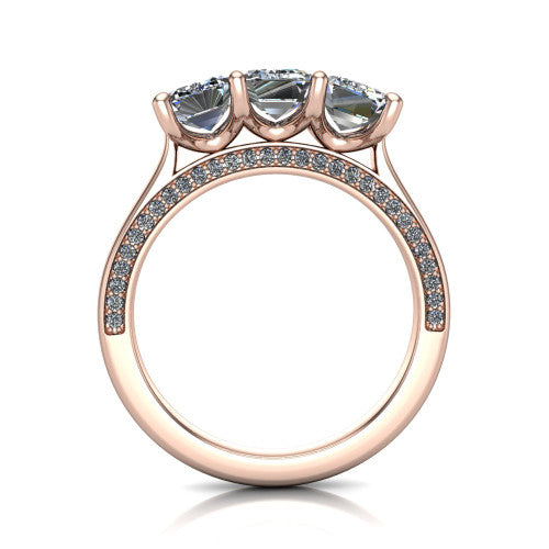 Maryam emerald three stone engagement ring in 18K Rose Gold, through-finger front profile showing the three-stone head and diamond-accented gallery above the pav&eacute; band