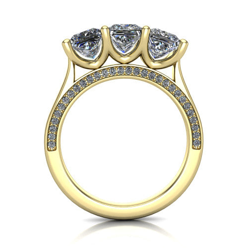 Maryam princess three stone engagement ring in 18K Yellow Gold, through-finger front profile showing the three-stone head and diamond-accented gallery above the pav&eacute; band