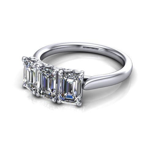 Amora emerald three stone engagement ring in Platinum, three-quarter perspective showing three emerald diamonds set side by side above a plain band