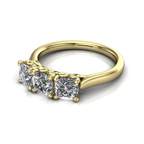Amora cushion three stone engagement ring in 18K Yellow Gold, three-quarter perspective showing three cushion diamonds set side by side above a plain band