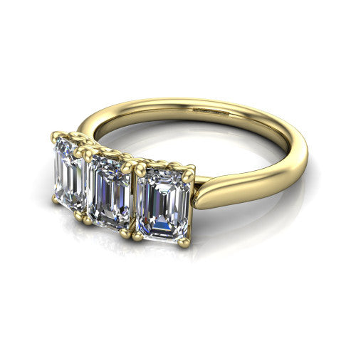 Amora emerald three stone engagement ring in 18K Yellow Gold, three-quarter perspective showing three emerald diamonds set side by side above a plain band