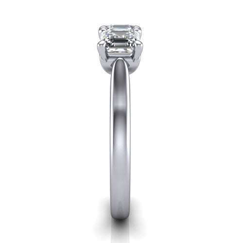 Amora square emerald three stone engagement ring in Platinum, side profile showing the plain polished band and the raised three-stone setting