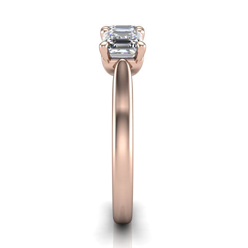 Amora square emerald three stone engagement ring in 18K Rose Gold, side profile showing the plain polished band and the raised three-stone setting