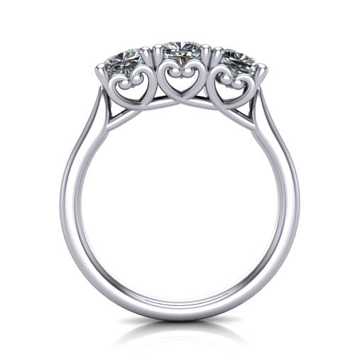 Amora cushion three stone engagement ring in Platinum, through-finger side profile showing the heart filigree scroll gallery beneath the three stones
