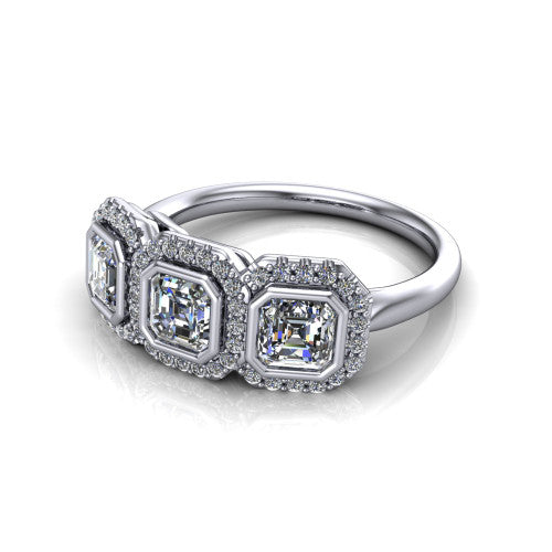 Lorelei square emerald three stone halo engagement ring in 18K White Gold, three-quarter perspective showing three square emerald stones each in a squared pav&eacute; halo above a plain band