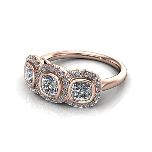 Lorelei cushion three stone halo engagement ring in 18K Rose Gold, three-quarter perspective showing three cushion stones each in a squared pav&eacute; halo above a plain band