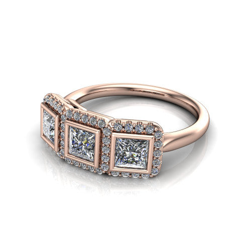 Lorelei princess three stone halo engagement ring in 14K Rose Gold, three-quarter perspective showing three princess stones each in a squared pav&eacute; halo above a plain band