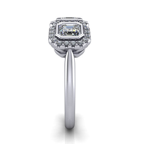 Lorelei square emerald three stone halo engagement ring in Platinum, side profile showing the plain polished band and the three-stone halo in profile