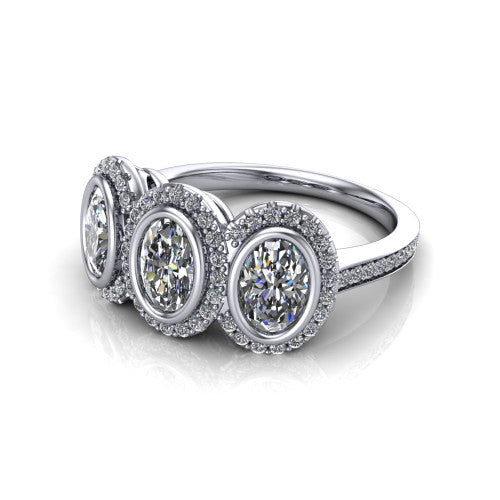 Aviana oval three stone halo engagement ring in 18K White Gold, three-quarter perspective showing three oval stones each in a squared pav&eacute; halo above a pav&eacute; band