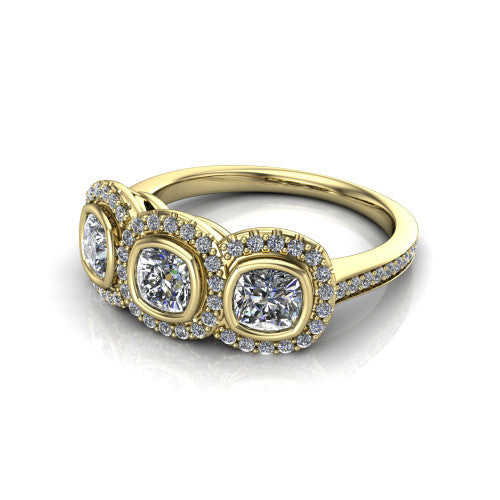 Aviana cushion three stone halo engagement ring in 18K Yellow Gold, three-quarter perspective showing three cushion stones each in a squared pav&eacute; halo above a pav&eacute; band