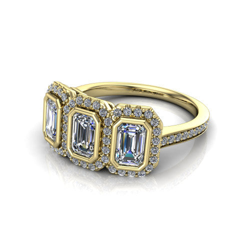 Aviana emerald three stone halo engagement ring in 14K Yellow Gold, three-quarter perspective showing three emerald stones each in a squared pav&eacute; halo above a pav&eacute; band