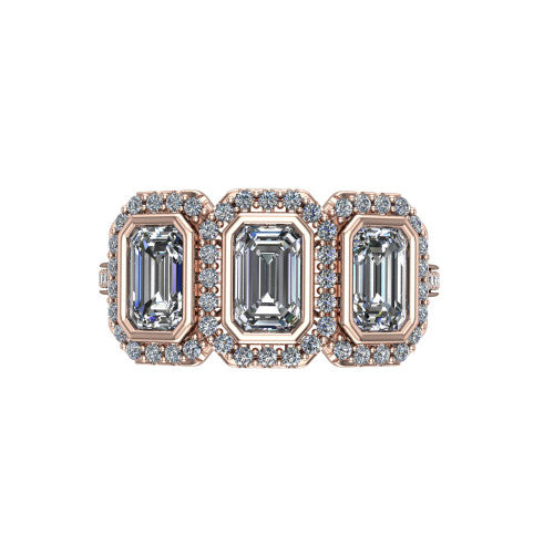 Aviana emerald three stone halo engagement ring in 18K Rose Gold, top-down view showing the three haloed emerald stones set side by side
