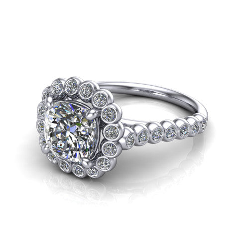 Maren cushion bezel bubble halo engagement ring in Platinum, three-quarter perspective showing the cushion center in a scalloped bezel-set bubble halo above a bezel-set band