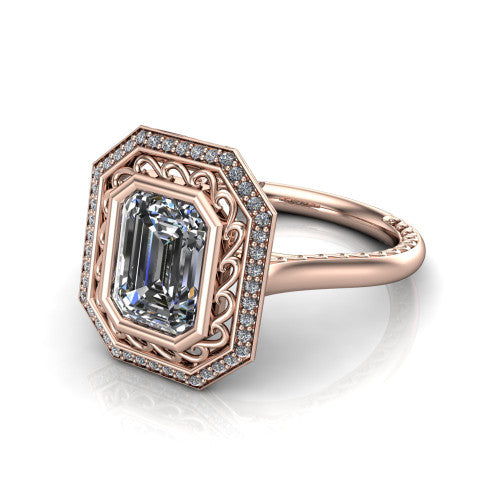 Collins emerald vintage halo engagement ring in 18K Rose Gold, three-quarter perspective showing the emerald center in a filigree-lined pav&eacute; halo above an engraved plain band