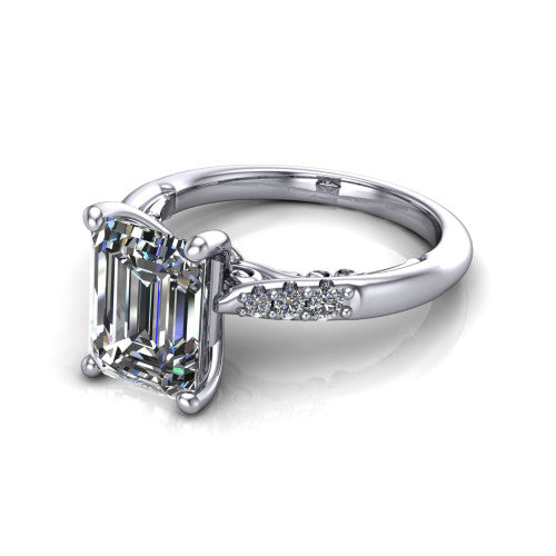 Jimena emerald solitaire engagement ring in 14K White Gold, three-quarter perspective showing the emerald center raised on claw prongs above pav&eacute; shoulders