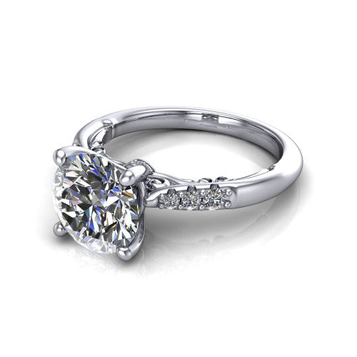 Jimena round solitaire engagement ring in 14K White Gold, three-quarter perspective showing the round center raised on claw prongs above pav&eacute; shoulders