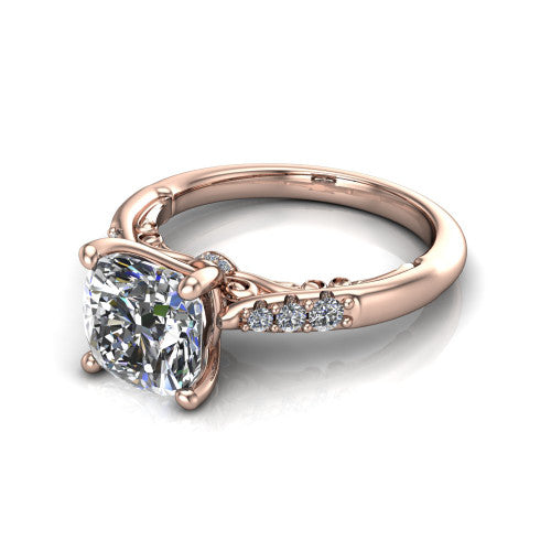 Jimena cushion solitaire engagement ring in 18K Rose Gold, three-quarter perspective showing the cushion center raised on claw prongs above pav&eacute; shoulders