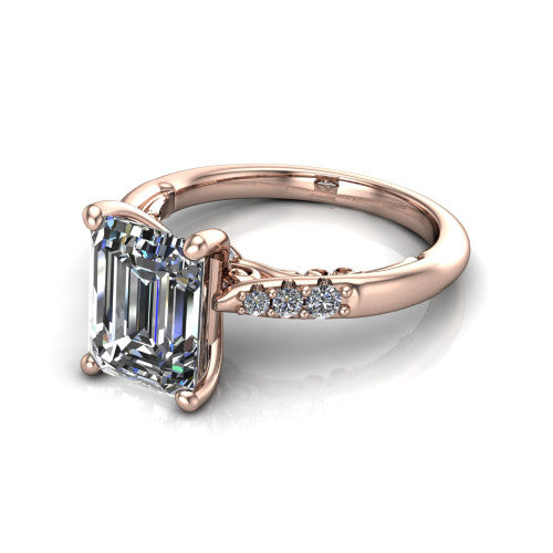 Jimena emerald solitaire engagement ring in 14K Rose Gold, three-quarter perspective showing the emerald center raised on claw prongs above pav&eacute; shoulders