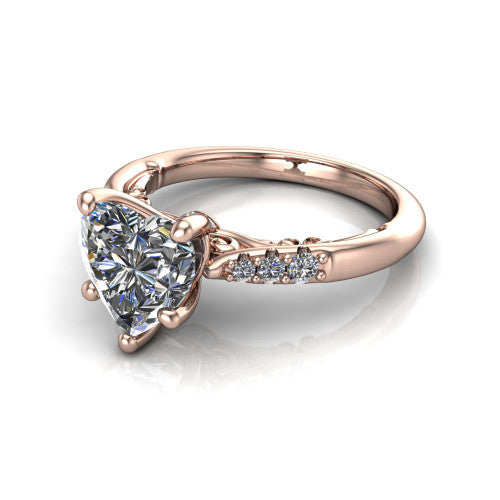 Jimena heart solitaire engagement ring in 14K Rose Gold, three-quarter perspective showing the heart center raised on claw prongs above pav&eacute; shoulders