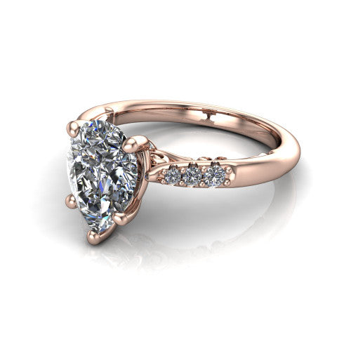 Jimena pear solitaire engagement ring in 14K Rose Gold, three-quarter perspective showing the pear center raised on claw prongs above pav&eacute; shoulders