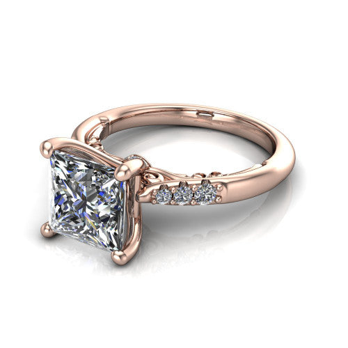 Jimena princess solitaire engagement ring in 18K Rose Gold, three-quarter perspective showing the princess center raised on claw prongs above pav&eacute; shoulders