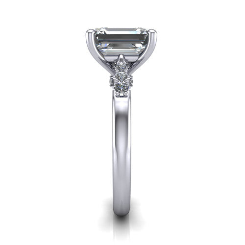 Jimena emerald solitaire engagement ring in 18K White Gold, side profile showing the pav&eacute; shoulders, filigree under-gallery, and tapered band