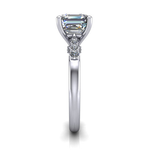 Jimena square emerald solitaire engagement ring in 18K White Gold, side profile showing the pav&eacute; shoulders, filigree under-gallery, and tapered band